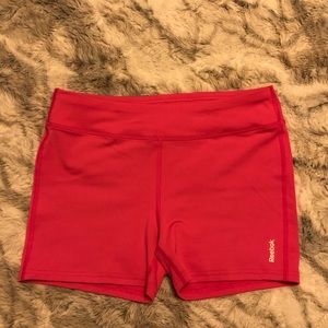 Neon pink Reebok gym shorts